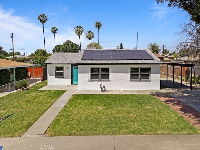 764 N Meridian Ave, Rialto, CA 92376 - view of front facade with stucco siding, roof with shingles, and roof mounted solar panels