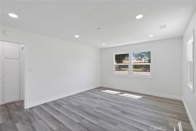 764 N Meridian Ave, Rialto, CA 92376 - spare room with wood finished floors, recessed lighting, baseboards, and a smoke detector