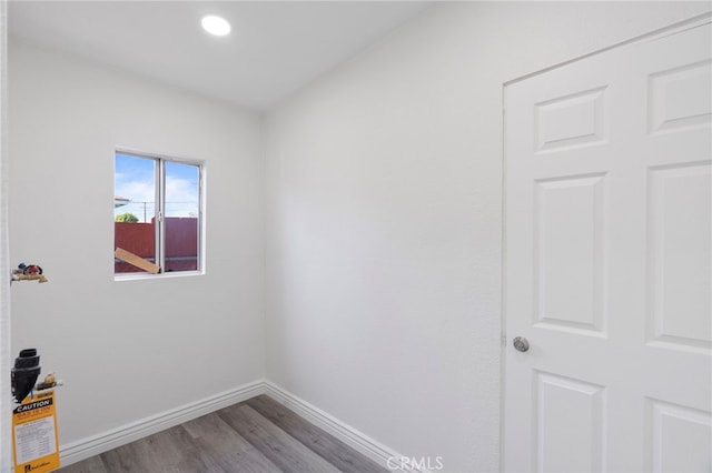 764 N Meridian Ave, Rialto, CA 92376 - empty room with wood finished floors, baseboards, and recessed lighting