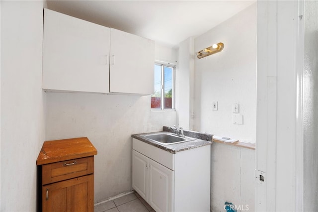 764 N Meridian Ave, Rialto, CA 92376 - kitchen with a sink, white cabinetry, and light tile patterned floors