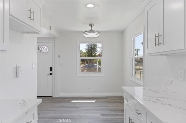 764 N Meridian Ave, Rialto, CA 92376 - unfurnished dining area featuring light wood-style floors and baseboards