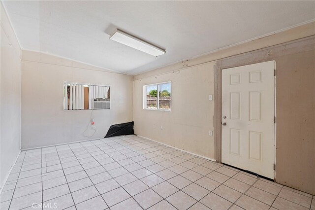 764 N Meridian Ave, Rialto, CA 92376 - spare room featuring vaulted ceiling and light tile patterned flooring