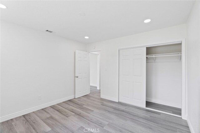 764 N Meridian Ave, Rialto, CA 92376 - unfurnished bedroom with recessed lighting, wood finished floors, baseboards, and a closet
