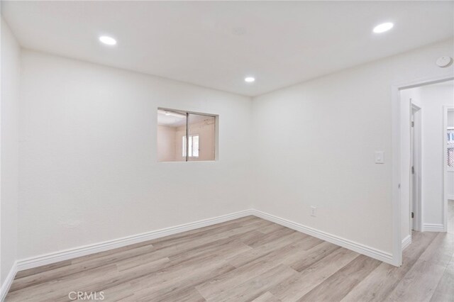 764 N Meridian Ave, Rialto, CA 92376 - empty room with light wood-type flooring, recessed lighting, and baseboards