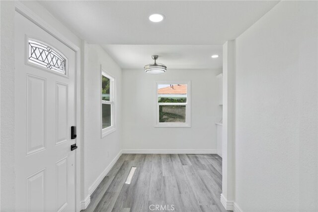 764 N Meridian Ave, Rialto, CA 92376 - unfurnished dining area featuring wood finished floors, baseboards, and recessed lighting