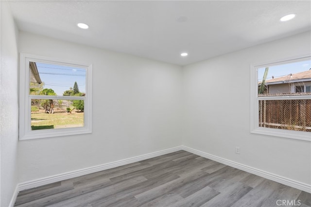764 N Meridian Ave, Rialto, CA 92376 - empty room with wood finished floors, baseboards, and recessed lighting