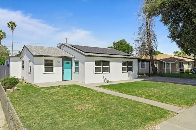 764 N Meridian Ave, Rialto, CA 92376 - view of front facade with roof mounted solar panels and stucco siding