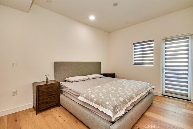 820 S Wilton Pl Unit 304, Los Angeles, CA 90005 - bedroom with light wood-type flooring, baseboards, and recessed lighting