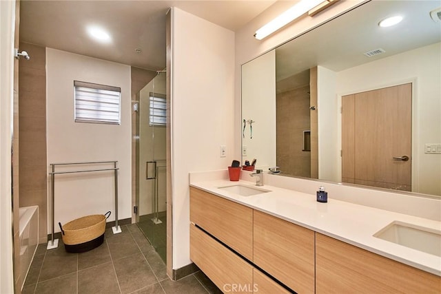 820 S Wilton Pl Unit 304, Los Angeles, CA 90005 - bathroom with a shower with door, tile patterned flooring, double vanity, a bathtub, and baseboards
