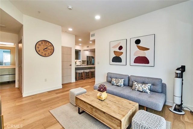 820 S Wilton Pl Unit 304, Los Angeles, CA 90005 - living room with light wood-style floors, baseboards, and recessed lighting