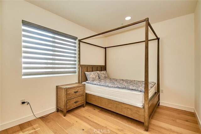 820 S Wilton Pl Unit 304, Los Angeles, CA 90005 - bedroom with light wood-style flooring, baseboards, and recessed lighting