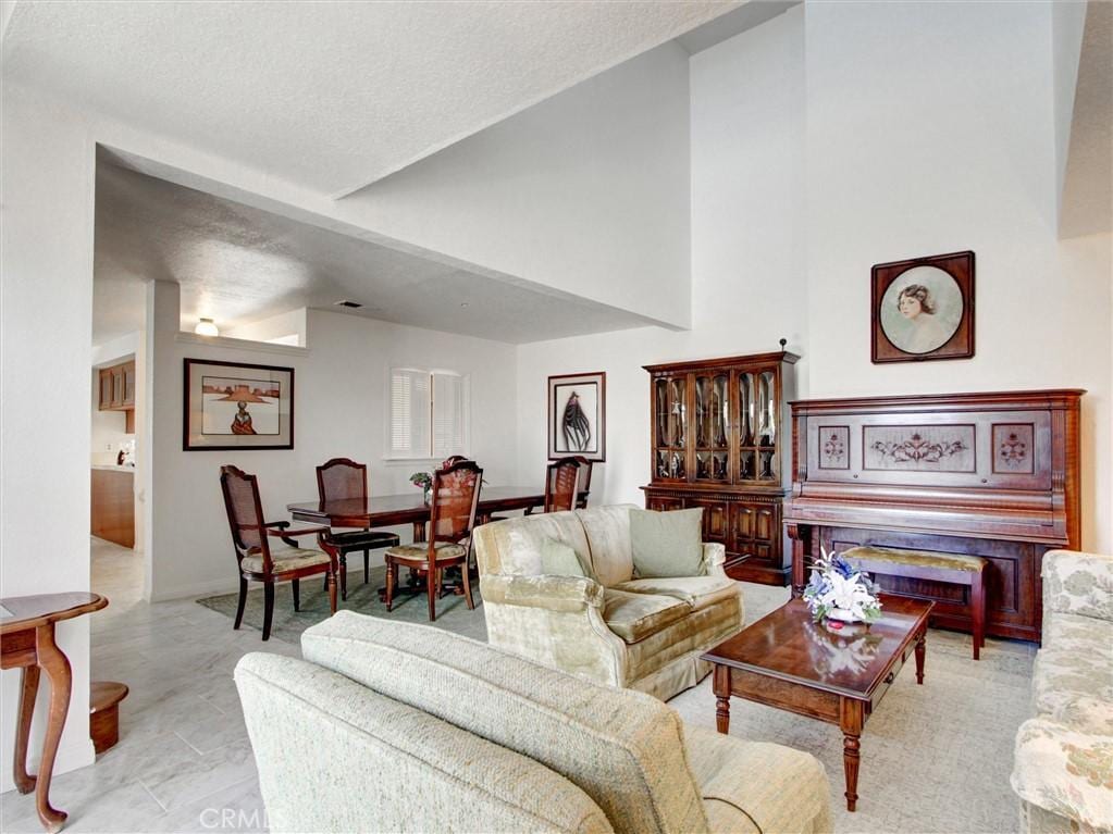 9031 Lampson Ave, Garden Grove, CA 92841 - living room featuring vaulted ceiling