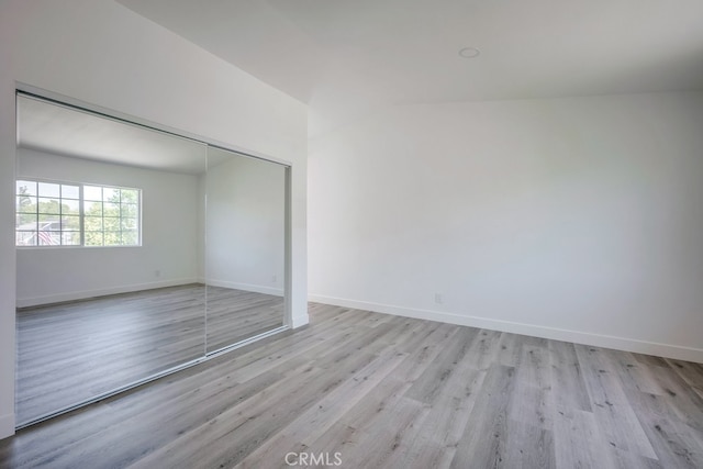 1264 W Etiwanda Ave, Rialto, CA 92376 - unfurnished bedroom featuring light wood-style flooring, baseboards, and a closet