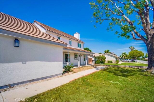 1264 W Etiwanda Ave, Rialto, CA 92376 - view of green lawn featuring covered porch