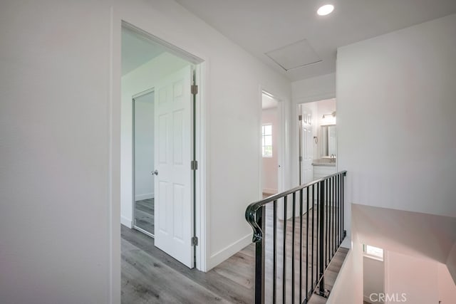 1264 W Etiwanda Ave, Rialto, CA 92376 - hall with wood finished floors, baseboards, recessed lighting, and attic access