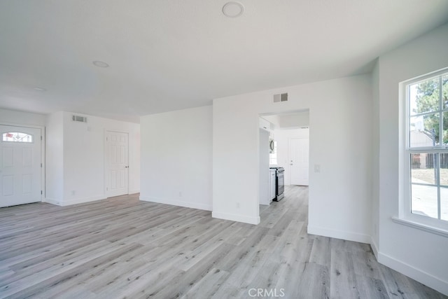 1264 W Etiwanda Ave, Rialto, CA 92376 - unfurnished living room featuring light wood-style floors and baseboards