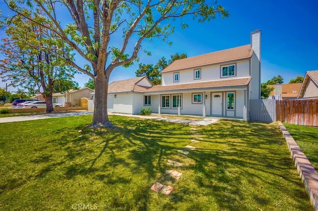 1264 W Etiwanda Ave, Rialto, CA 92376 - view of front facade with a chimney and covered porch