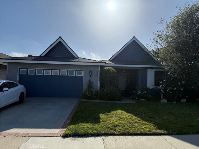 15911 Dundalk Ln, Huntington Beach, CA 92647 - single story home featuring driveway, a front yard, an attached garage, and stucco siding