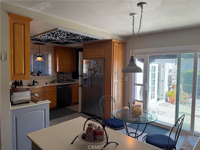 15911 Dundalk Ln, Huntington Beach, CA 92647 - kitchen with stainless steel fridge, dishwasher, light tile patterned flooring, light countertops, and plenty of natural light