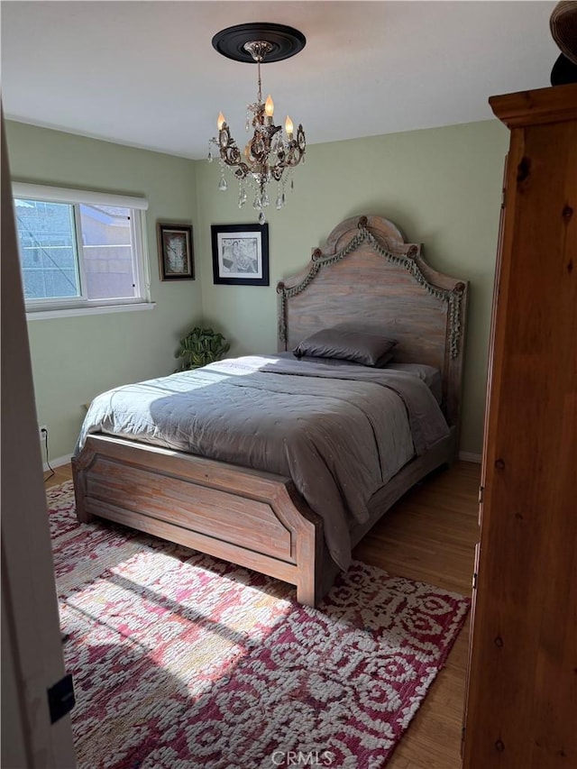 15911 Dundalk Ln, Huntington Beach, CA 92647 - bedroom with wood finished floors, a chandelier, and baseboards