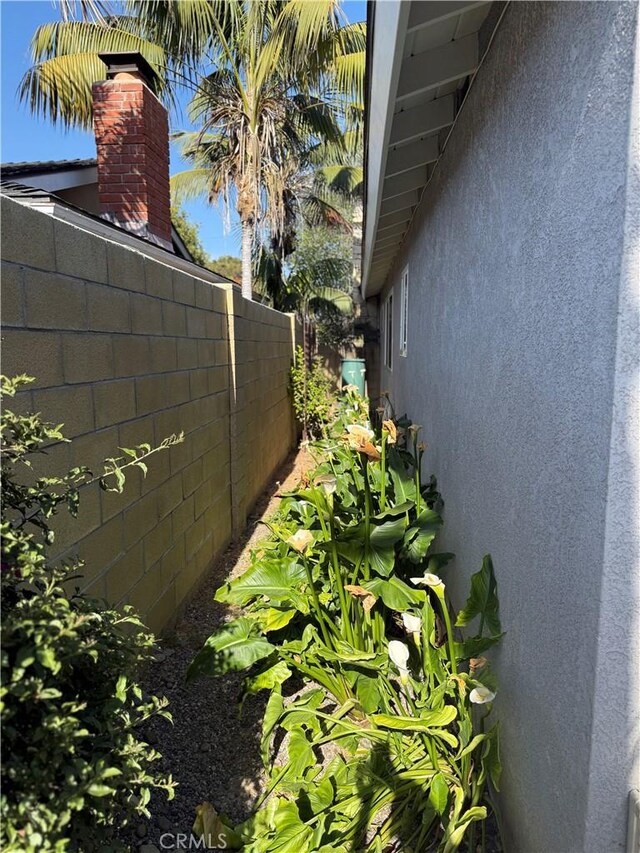 15911 Dundalk Ln, Huntington Beach, CA 92647 - view of side of home with stucco siding