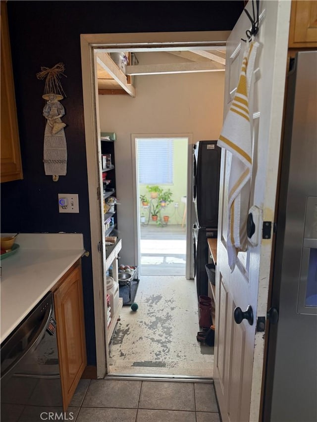 15911 Dundalk Ln, Huntington Beach, CA 92647 - kitchen featuring dishwasher, light countertops, light tile patterned floors, and brown cabinetry