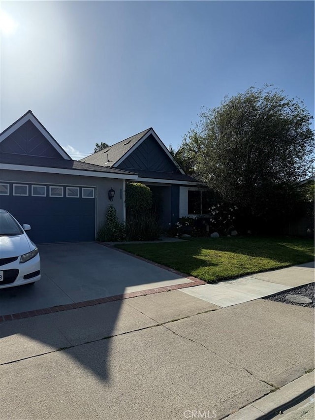 15911 Dundalk Ln, Huntington Beach, CA 92647 - ranch-style house featuring a front yard, an attached garage, and concrete driveway