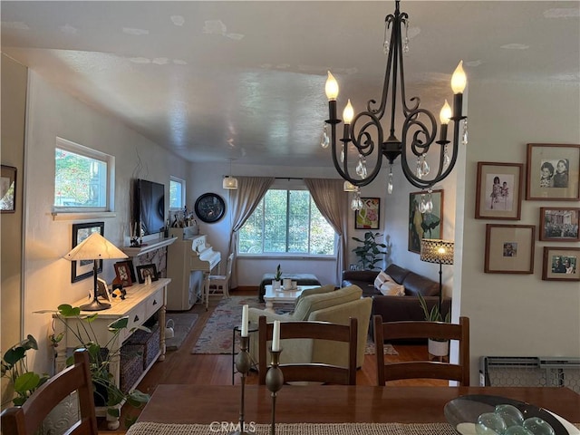 15911 Dundalk Ln, Huntington Beach, CA 92647 - living room featuring wood finished floors, plenty of natural light, and a chandelier
