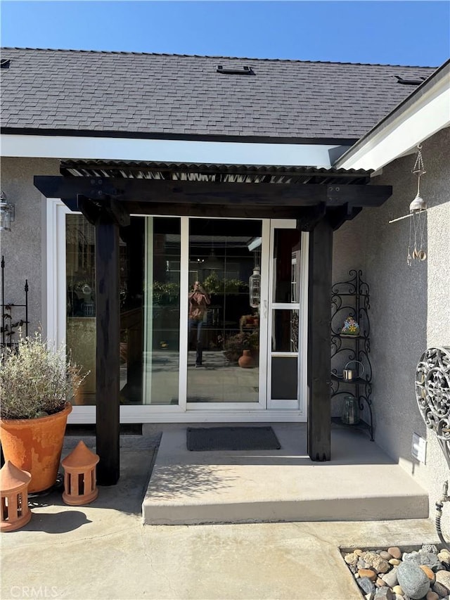 15911 Dundalk Ln, Huntington Beach, CA 92647 - doorway to property featuring stucco siding and roof with shingles