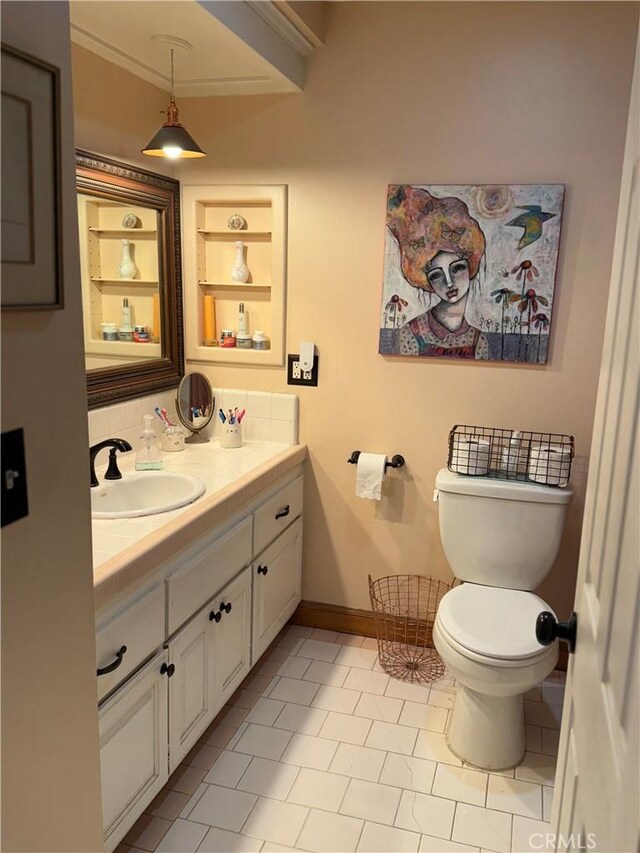 15911 Dundalk Ln, Huntington Beach, CA 92647 - bathroom with vanity, toilet, baseboards, and tile patterned floors