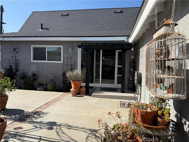 15911 Dundalk Ln, Huntington Beach, CA 92647 - rear view of property with stucco siding, roof with shingles, and a patio area