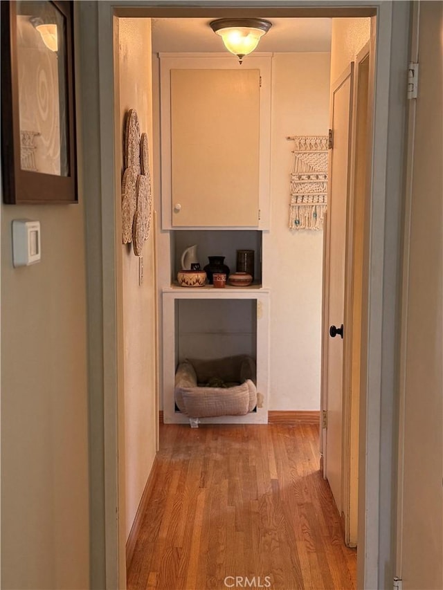 15911 Dundalk Ln, Huntington Beach, CA 92647 - hallway with light wood finished floors and baseboards