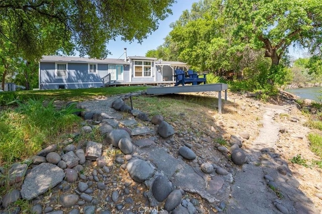 8510 Verdant Ct, Los Molinos, CA 96055 - view of front of home with a sunroom
