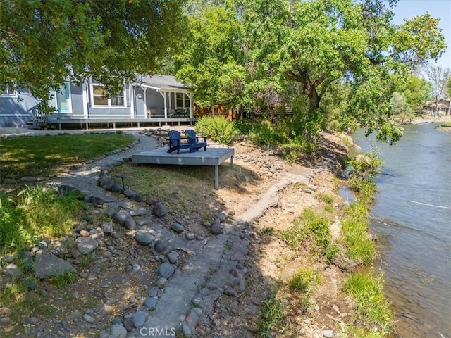 8510 Verdant Ct, Los Molinos, CA 96055 - view of yard with a sunroom and a water view