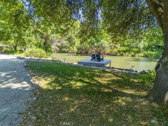 8510 Verdant Ct, Los Molinos, CA 96055 - view of grassy yard featuring a water view and a dock