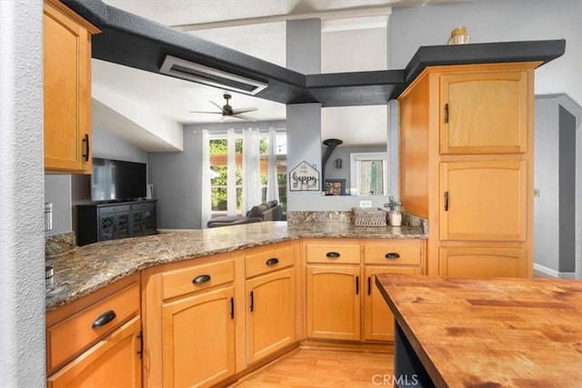 8510 Verdant Ct, Los Molinos, CA 96055 - kitchen featuring wooden counters, light wood finished floors, open floor plan, a ceiling fan, and a peninsula