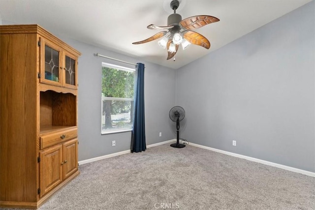 8510 Verdant Ct, Los Molinos, CA 96055 - empty room featuring light colored carpet, a ceiling fan, and baseboards