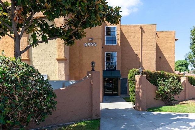 6955 Alvarado Rd Unit 77, San Diego, CA 92120 - view of front of home with stucco siding
