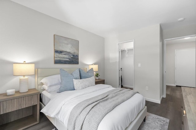 6955 Alvarado Rd Unit 77, San Diego, CA 92120 - bedroom featuring wood finished floors, a walk in closet, baseboards, and a closet