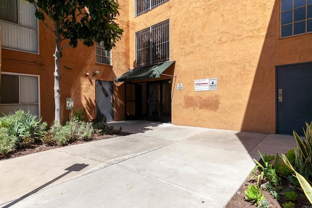 6955 Alvarado Rd Unit 77, San Diego, CA 92120 - view of exterior entry featuring stucco siding