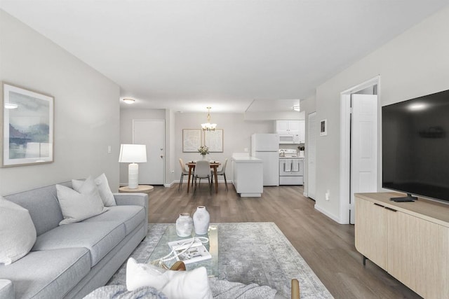 6955 Alvarado Rd Unit 77, San Diego, CA 92120 - living room featuring a chandelier, wood finished floors, and baseboards
