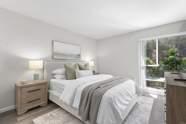 6955 Alvarado Rd Unit 77, San Diego, CA 92120 - bedroom featuring light wood-type flooring and baseboards