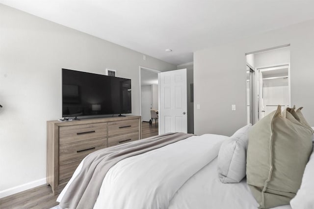 6955 Alvarado Rd Unit 77, San Diego, CA 92120 - bedroom with baseboards and wood finished floors