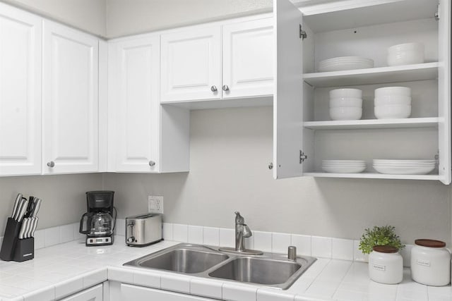 6955 Alvarado Rd Unit 77, San Diego, CA 92120 - kitchen featuring a sink, white cabinetry, and open shelves
