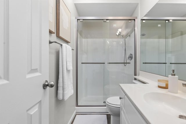 6955 Alvarado Rd Unit 77, San Diego, CA 92120 - bathroom featuring toilet, vanity, a shower stall, and baseboards
