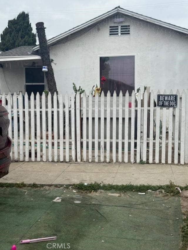 3815 Paloma St, Los Angeles, CA 90011 - view of side of home with stucco siding