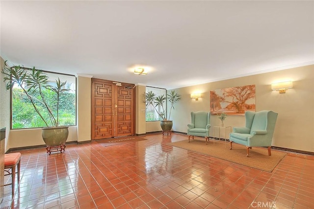 330 W California Blvd Unit 111, Pasadena, CA 91105 - living area with crown molding, baseboards, and light tile patterned floors