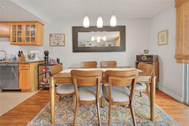 330 W California Blvd Unit 111, Pasadena, CA 91105 - dining space featuring light wood-style floors and baseboards