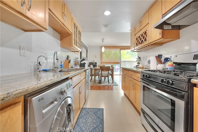 330 W California Blvd Unit 111, Pasadena, CA 91105 - kitchen with appliances with stainless steel finishes, under cabinet range hood, washer / dryer, light brown cabinetry, and recessed lighting