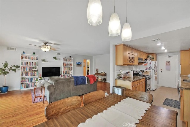 330 W California Blvd Unit 111, Pasadena, CA 91105 - dining area with ceiling fan, light wood-style flooring, and baseboards